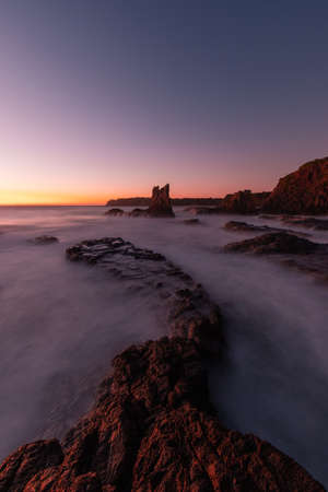 Dawn view of Cathedral Rocks, Kiama, Australia.の写真素材
