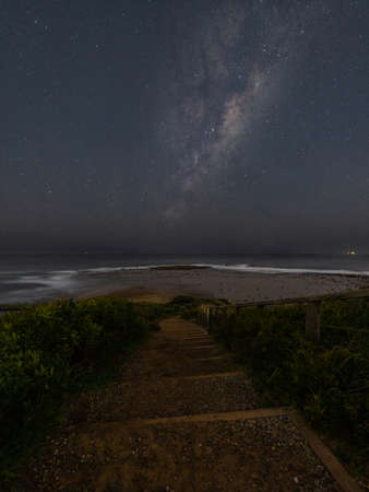 Stair to the sea with milky way galaxy.の写真素材