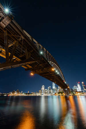 Sydney, Australia - June 25, 2022: Night view of Sydney Harbour with clear sky.