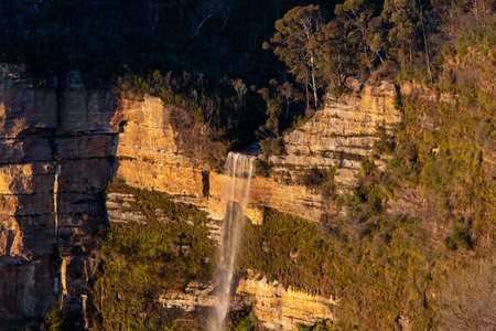 Tall waterfall in the mountain.の写真素材