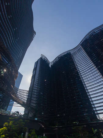 Singapore - May 22, 2022: Looking up view at Marina One buildings.のeditorial素材