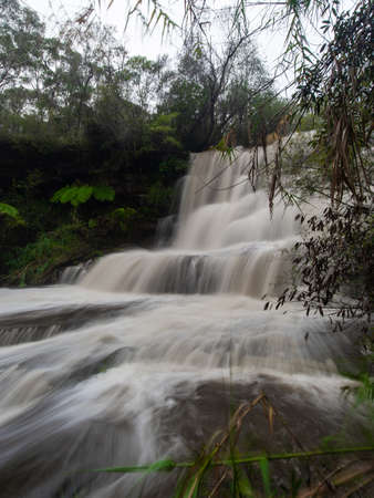 Strong waterfall current after heavy rain.の写真素材