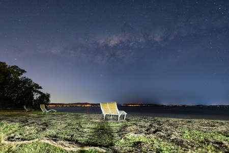 An empty seat under the milky way galaxy.の写真素材