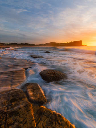 Beautiful sunrise view along Avalon Beach coastline, Sydney, Australia.の写真素材