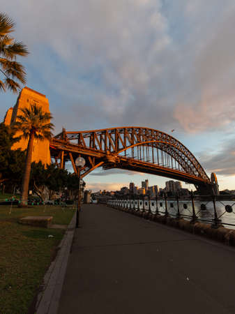 Sydney, Australia - August 14, 2022: Warm sunlight on Sydney Harbour Bridge in the morning.の写真素材