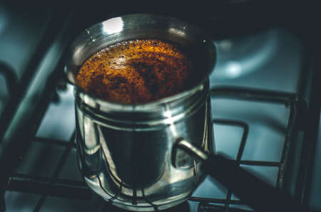 Turkish coffee brewing pot on the gas cooker. jezve. Stone coffeepotの写真素材