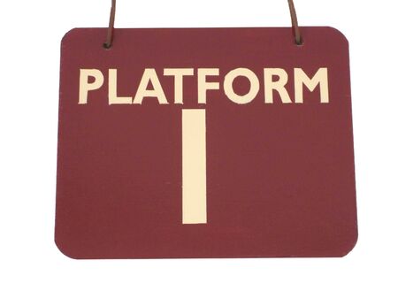 A Sign for Platform 1 at a Train Station.の写真素材