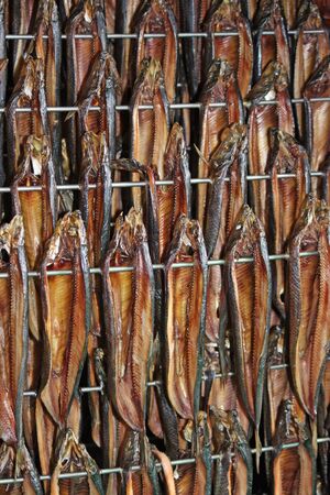 Freshly Smoked Kippers Hanging in a Smoking Cabinet.の写真素材