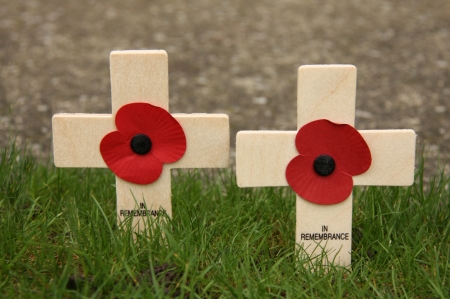 Two Remembrance Day Wooden Crosses with Poppys.の写真素材