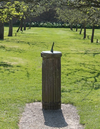 A Classic Vintage Sundial in an Apple Tree Orchard 