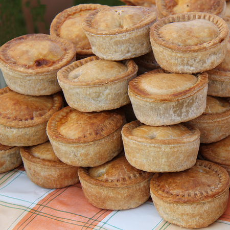 A Display of Freshly Made Pork Pies の写真素材