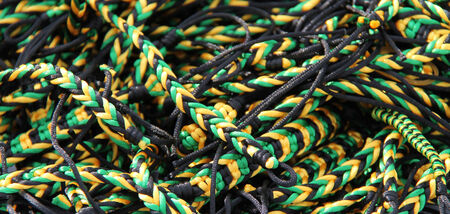 A Collection of Jamaican Coloured String Bracelets 