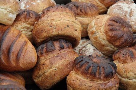 A Pile of Freshly Baked Crusty Bread Loaves.