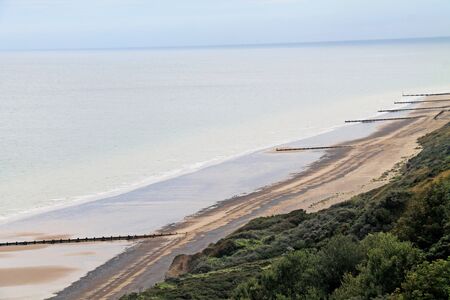 A Seascape of Wooden Sea Defence Beach Groynes.の写真素材