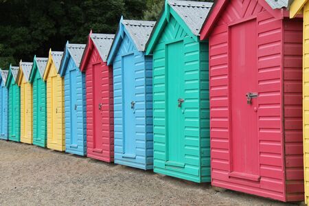 A Collection of Wooden Beach Huts at the Seaside.の写真素材
