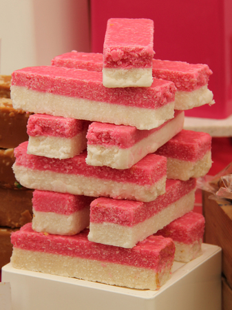 A Display of Pink and White Fudge Sweets.の写真素材