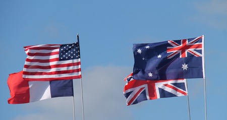 Four National Country Flags Flying on a Sunny Day.の写真素材