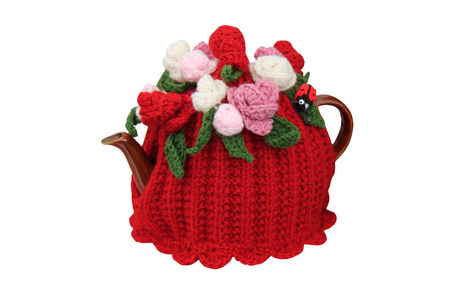 A Woollen Knitted Tea Cosy on a Teapot.の写真素材