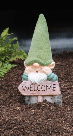 A Welcome Sign and Cute Garden Gnome Ornament.