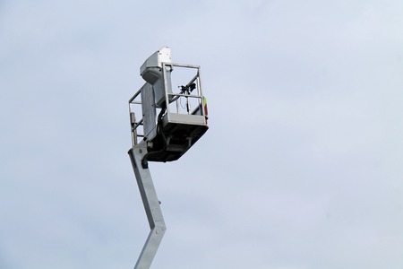 The Cage at the Top of a High Lift Cherry Picker Crane.の写真素材