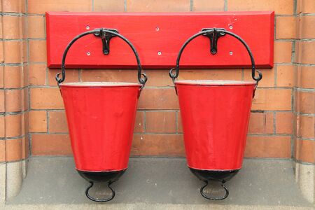 Two Red Vintage Metal Fire Sand Buckets.の写真素材