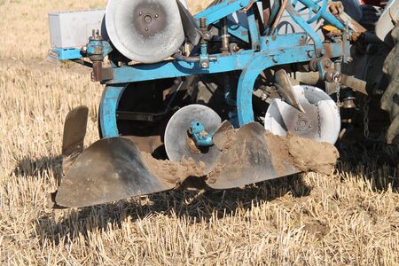 The Mud Covered Blades of a Vintage Farming Plough.