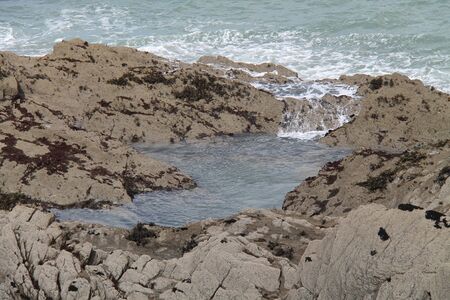 Sea Water Flowing into Coastal Rock Pool.