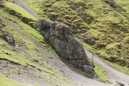 A Rocky Outcrop on a Steep Sided Mountain Hillside.