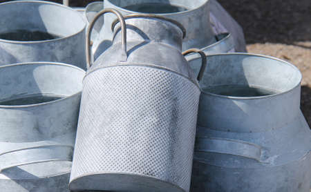 A Collection of Ornamental Metal Vintage Milk Churns.の写真素材