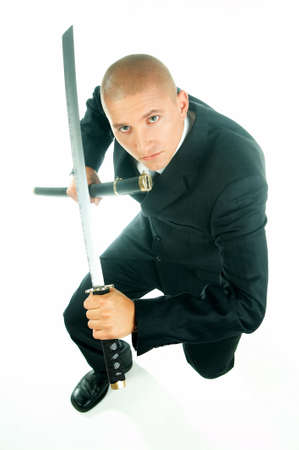 A young businessman with a blue tie and white shirt with katana