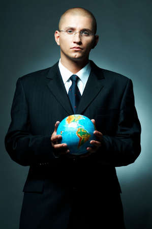 A Young businessman holding a earth model