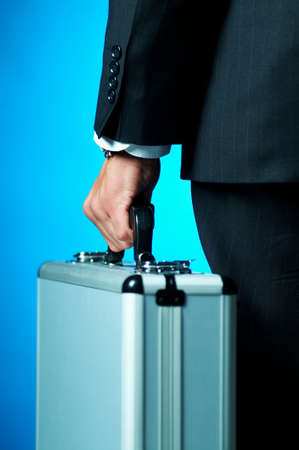 A businessman holding caseの写真素材