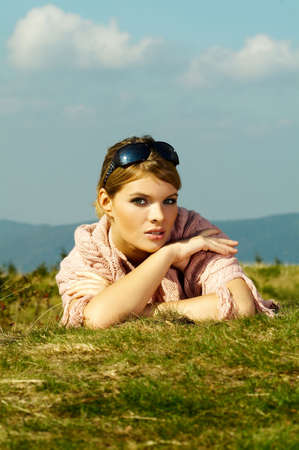 Young business woman relaxing on mountains outdoorsの写真素材