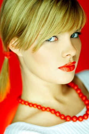 Portrait of attractive beautiful young sexy woman red necklaceの写真素材