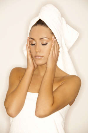 Portrait of Fresh and Beautiful brunette woman wearing white towel on her head