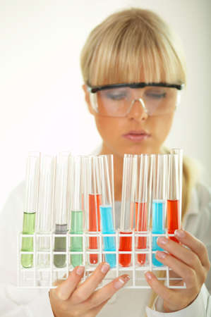 Female lab worker testing and experimenting