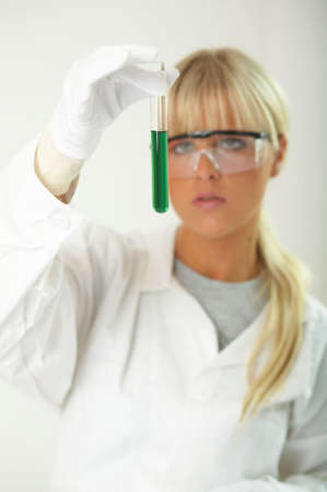 Female lab worker testing and experimenting