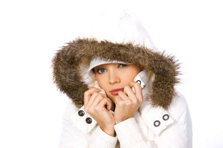 Portrait of beautiful woman wearing hooded winter jacketの写真素材