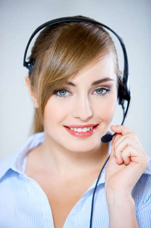 Portrait of beautiful business woman with headset の写真素材