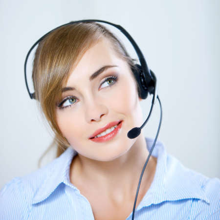 Portrait of beautiful business woman with headset の写真素材