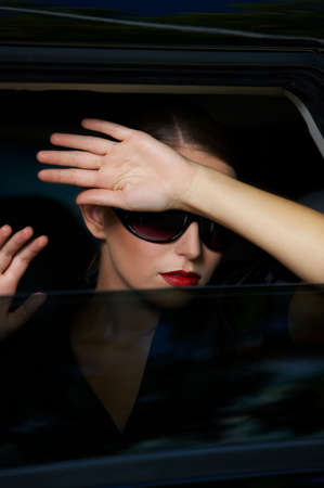 Portrait of beautiful business woman inside the limo car