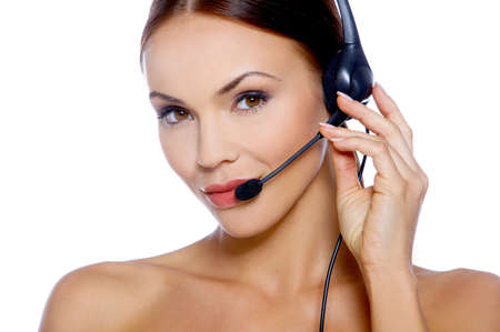 Beautiful girl is using headset, isolated on whiteの写真素材