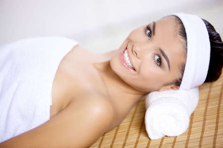 Young beautiful and relaxed taking spa treatmentの写真素材