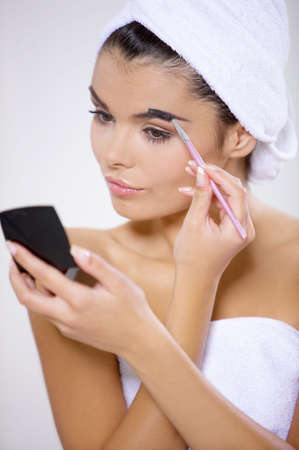 Portrait of beautiful woman wearing towel on her headの写真素材