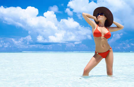 Beautiful woman resting in water at Maldivesの写真素材