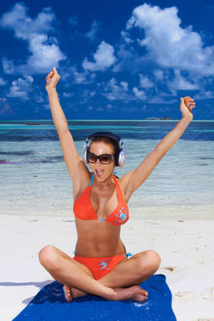 Beautiful woman resting near water at Maldivesの写真素材