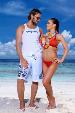 Romantic couple resting at Maldives seasideの写真素材