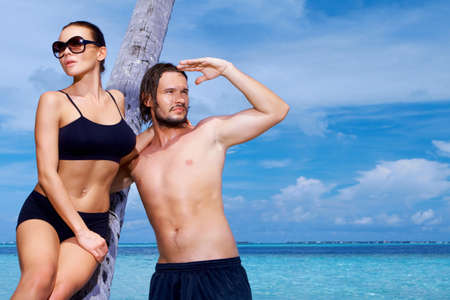 Romantic couple resting at Maldives seasideの写真素材