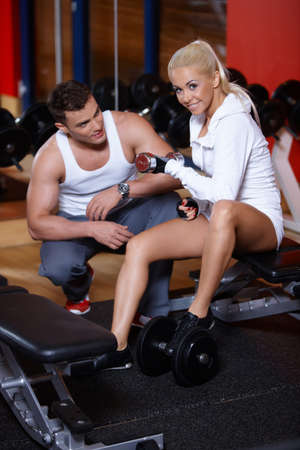 Sporty couple exercising at the gymの写真素材