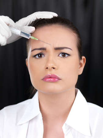 Portrait of beautiful woman, she gets botox injectionの写真素材
